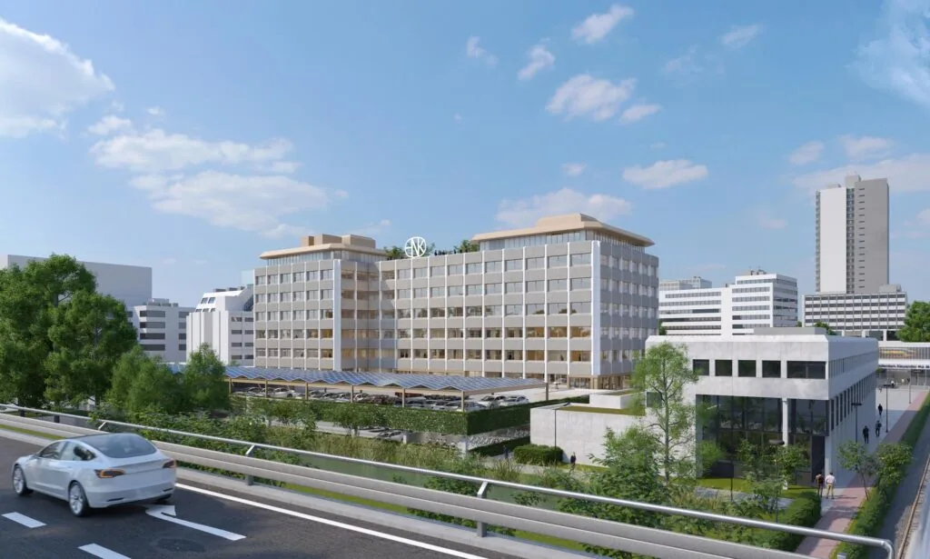 Kantoorcomplex aan de Marten Meesweg in Rotterdam, gezien vanaf een naastgelegen snelweg met een witte auto op de voorgrond.